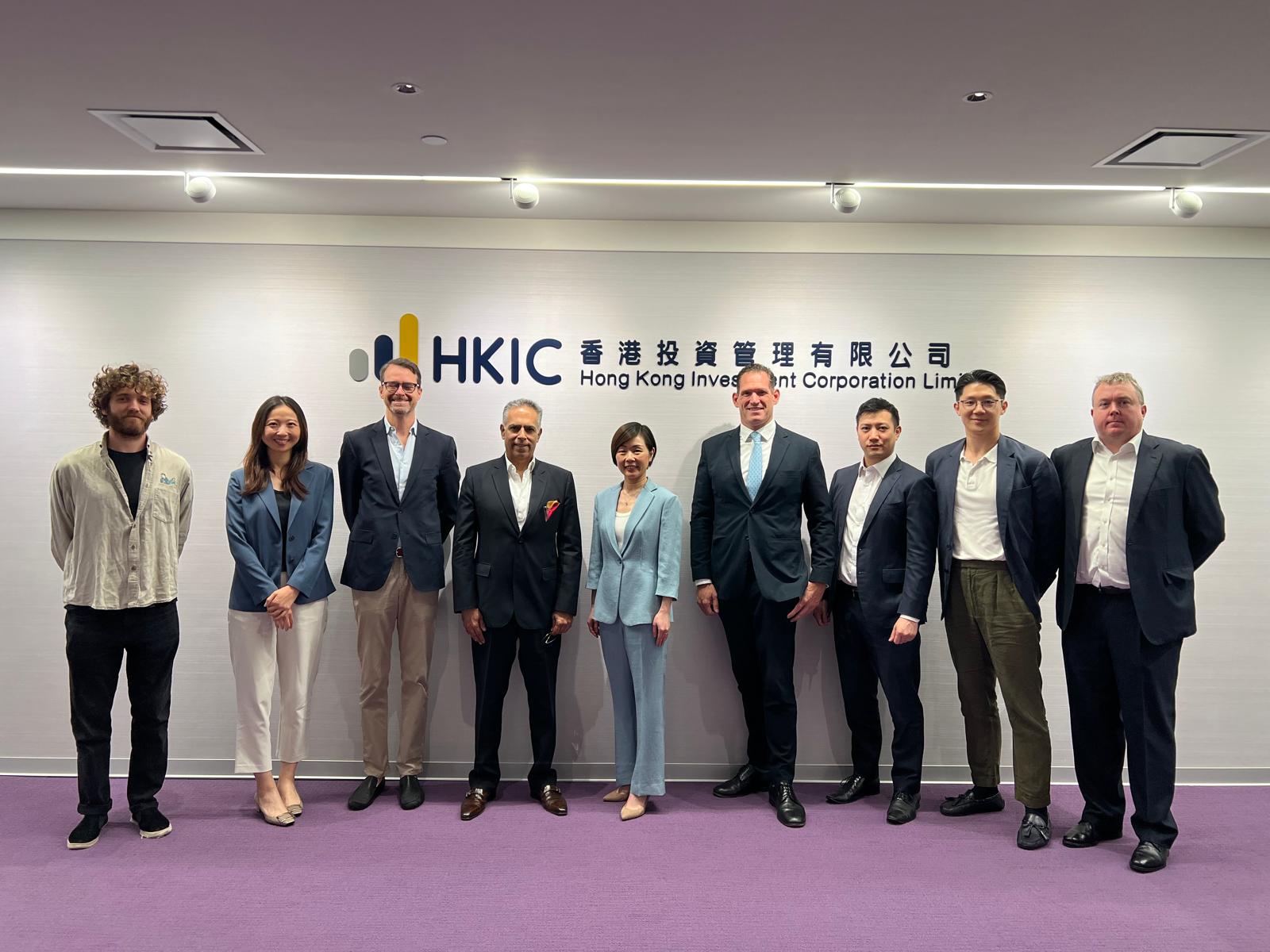 Black and white photo of a women performing modern dance on a dark background.